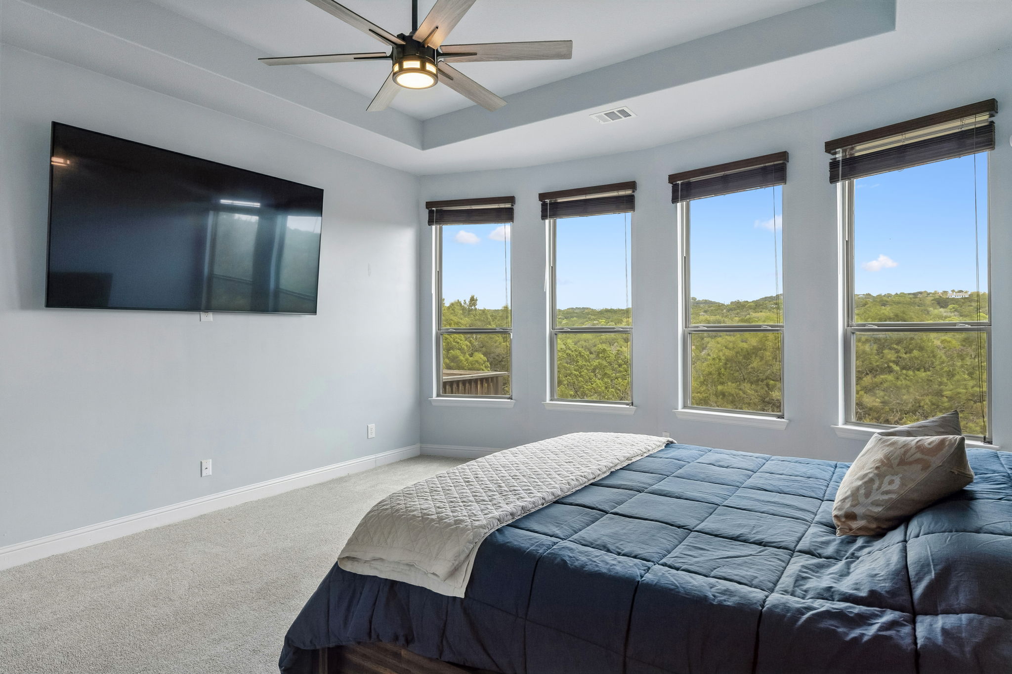 7212 Celebration Court Leander, TX 78645 - Photo 24 of 39 a bedroom with a bed and a flat screen tv