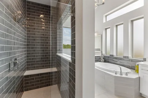 a bathroom with a bathtub and shower