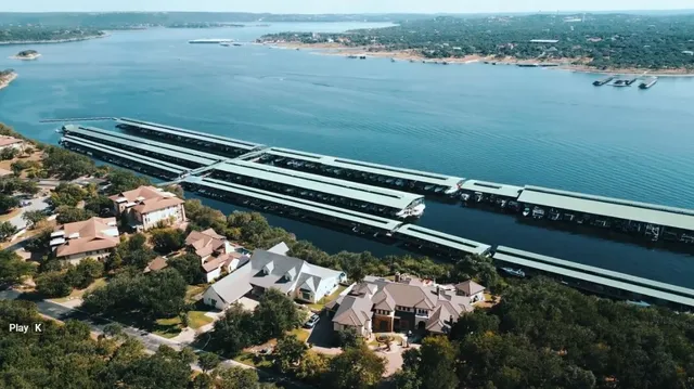 a front view of a house with a garden and plants
