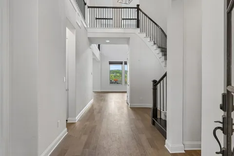 a view of entryway with wooden floor
