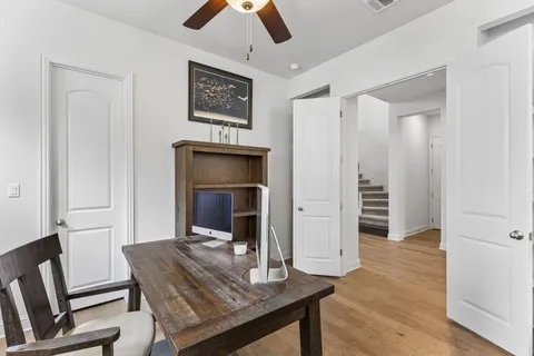 a view of a livingroom with furniture and wooden floor