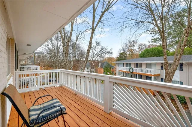 a view of a wooden deck with a yard