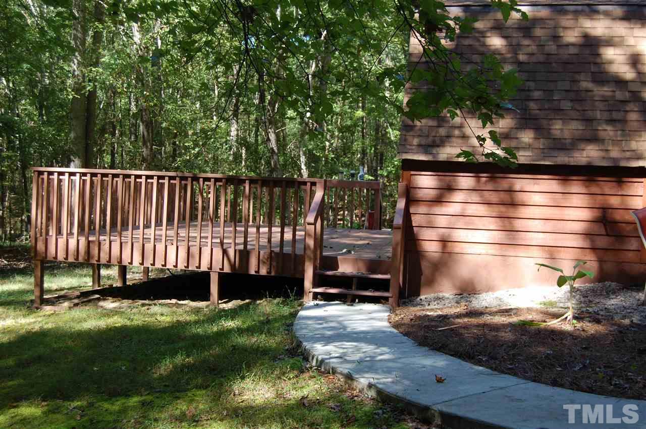 1121 Batchelor Road Apex, NC 27523 - Photo 29 of 30 Concrete patio goes from front patio around to back deck!