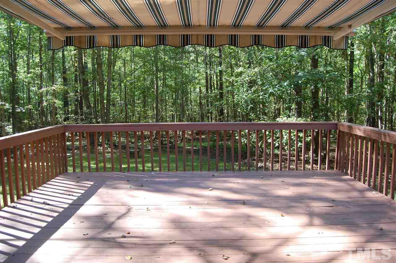 1121 Batchelor Road Apex, NC 27523 - Photo 8 of 30 View of the back deck (18.2x7.9) w/the electric awning fully extended to cover this deck (there are 2) right off the Dining Room!