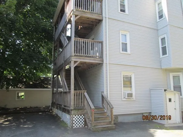 a view of a house with a tree