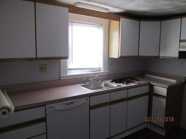 53 Pearl Street, Unit 3 Melrose, MA 02176 - Photo 7 of 20 a kitchen with a sink cabinets and window