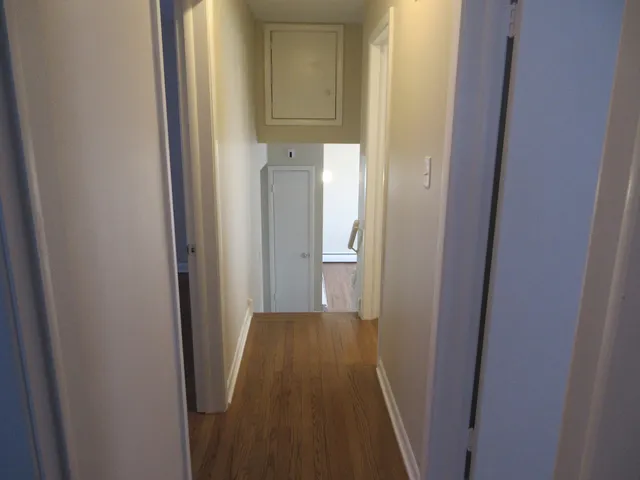 a view of a bathroom from a hallway