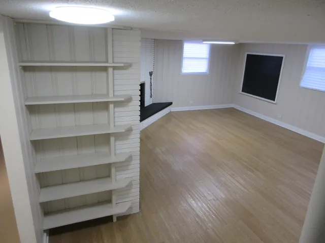 a view of an empty room with a closet