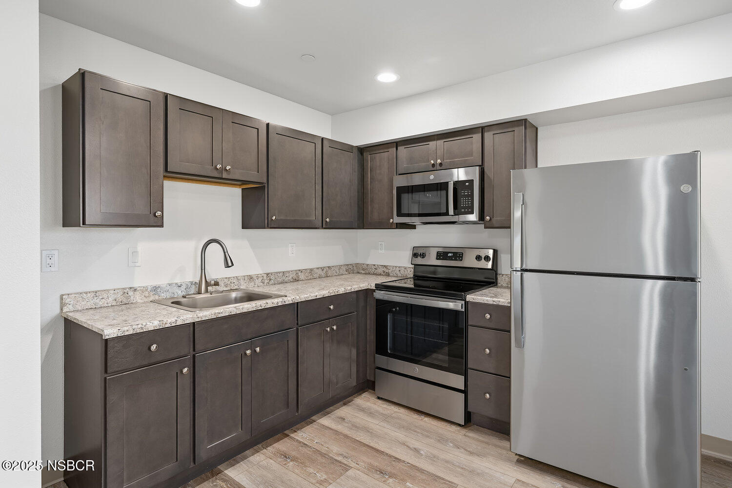 529 South Pine Street Santa Maria, CA 93458 - Photo 13 of 80 a kitchen with a sink a stove a refrigerator and cabinets
