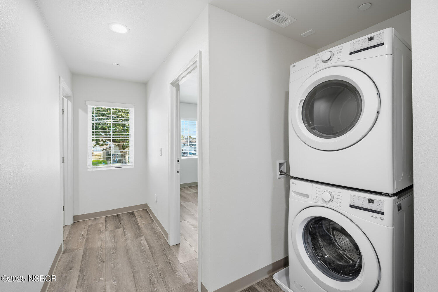 529 South Pine Street Santa Maria, CA 93458 - Photo 20 of 80 a view of a hallway with washer and dryer