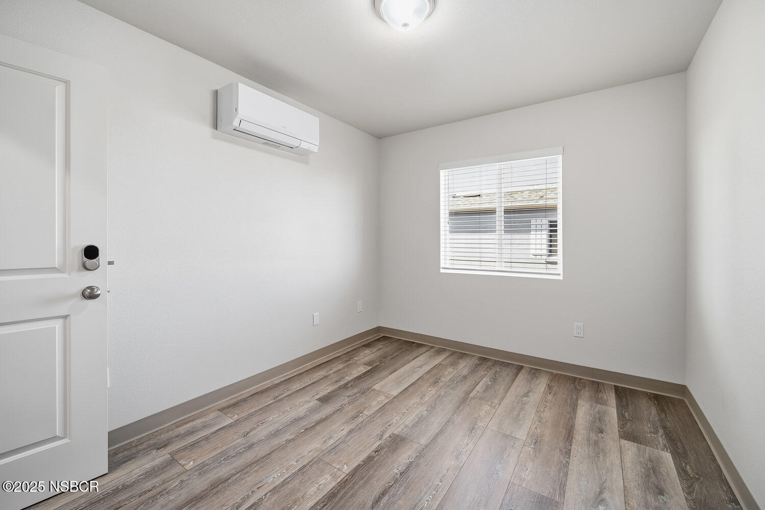 529 South Pine Street Santa Maria, CA 93458 - Photo 24 of 80 a view of room with hardwood floor and window