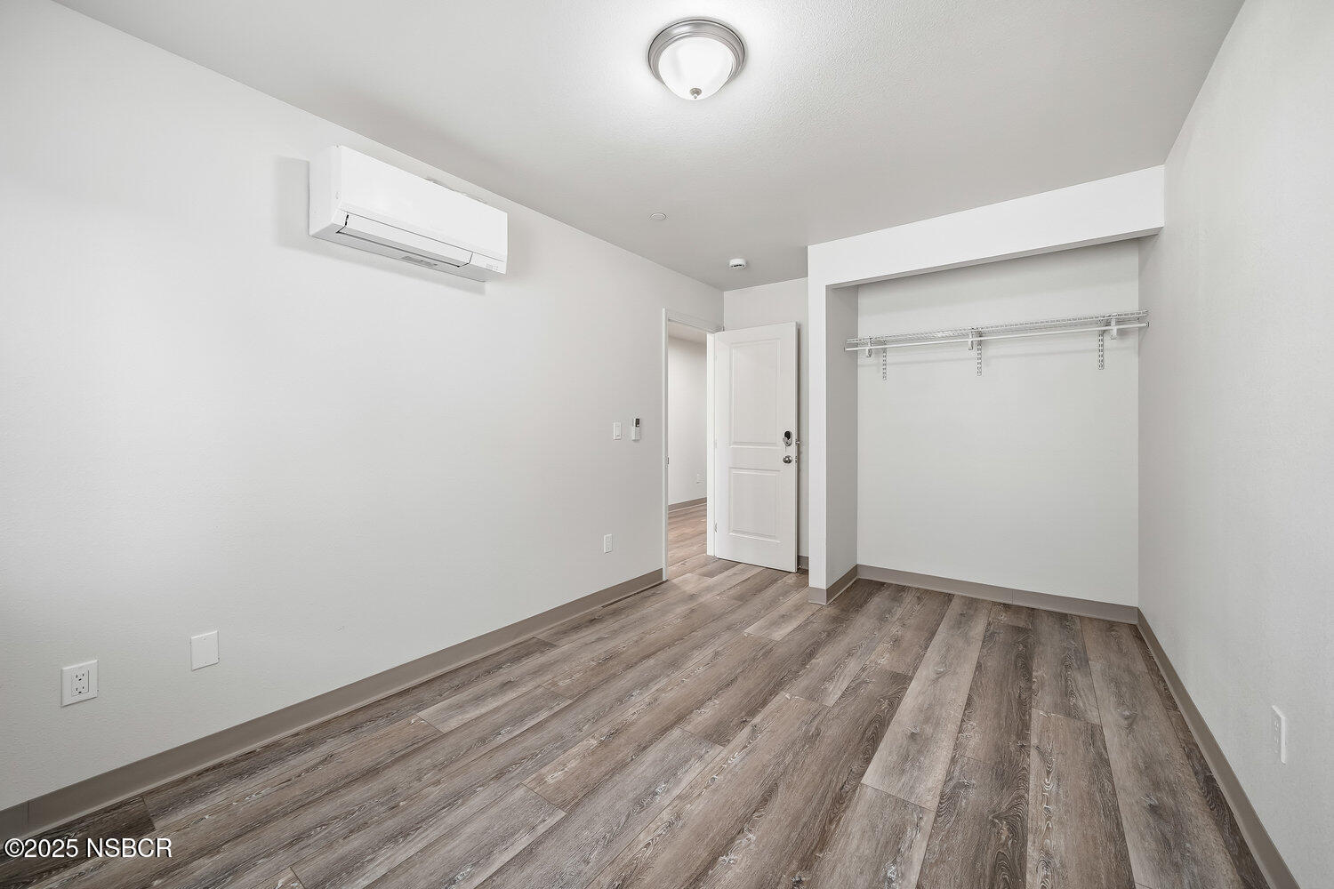 529 South Pine Street Santa Maria, CA 93458 - Photo 28 of 80 a view of an empty room with wooden floor and a window
