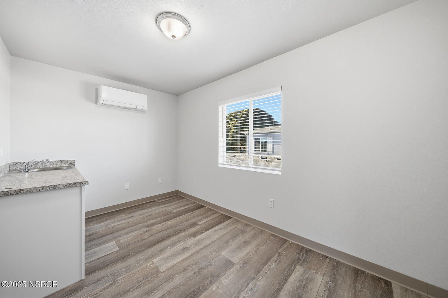 529 South Pine Street Santa Maria, CA 93458 - Photo 35 of 80 an empty room with a stove and a window