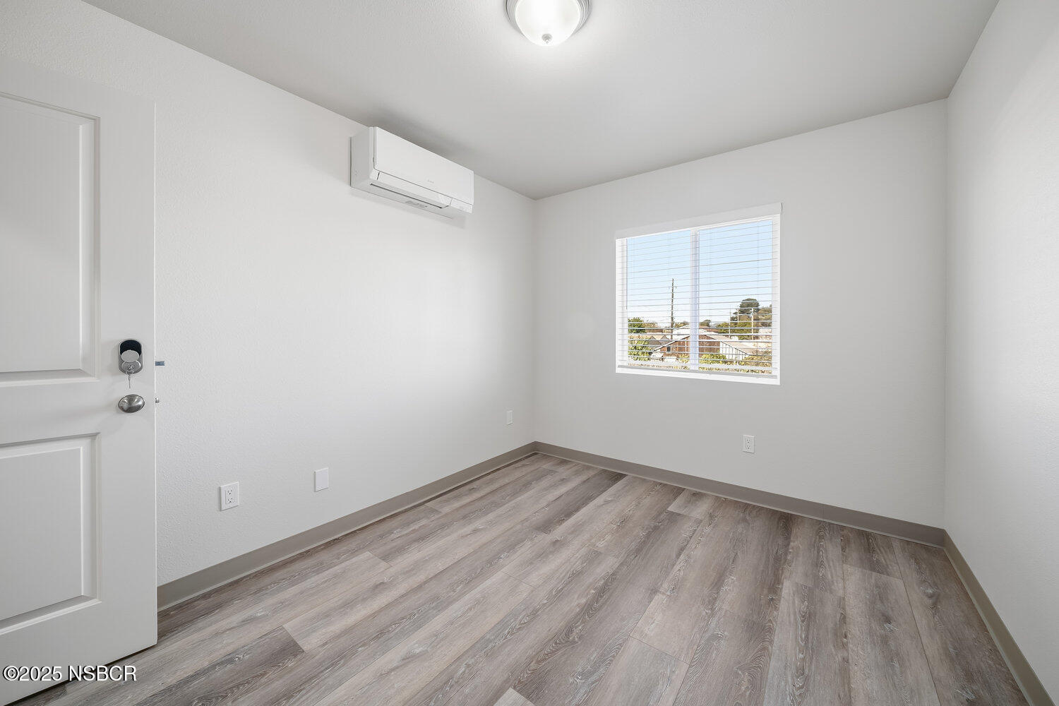 529 South Pine Street Santa Maria, CA 93458 - Photo 42 of 80 an empty room with wooden floor and windows