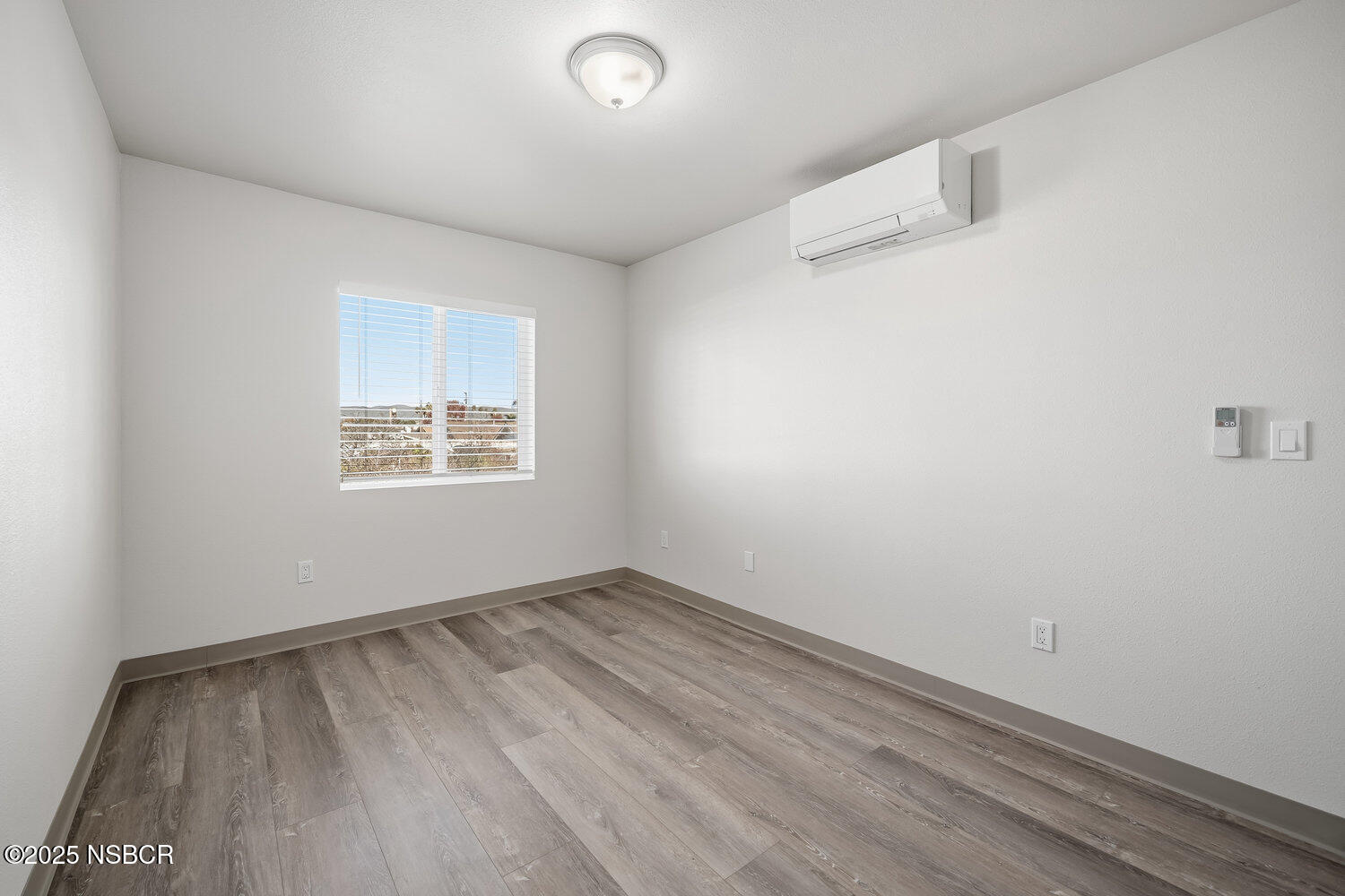 529 South Pine Street Santa Maria, CA 93458 - Photo 46 of 80 an empty room with a white cabinet and a window