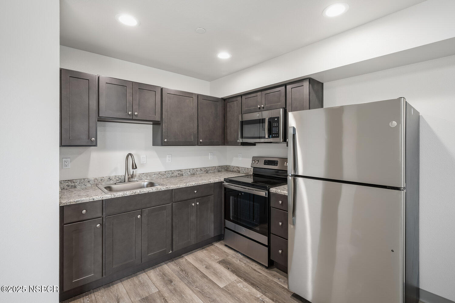 529 South Pine Street Santa Maria, CA 93458 - Photo 8 of 80 a kitchen with a refrigerator sink and microwave