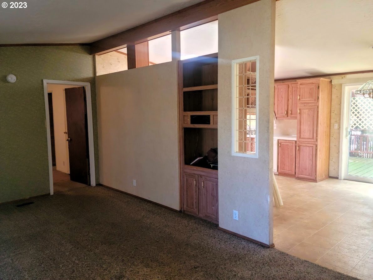 334 Archie Street Eugene, OR 97402 - Photo 2 of 3 an empty room with closet and windows