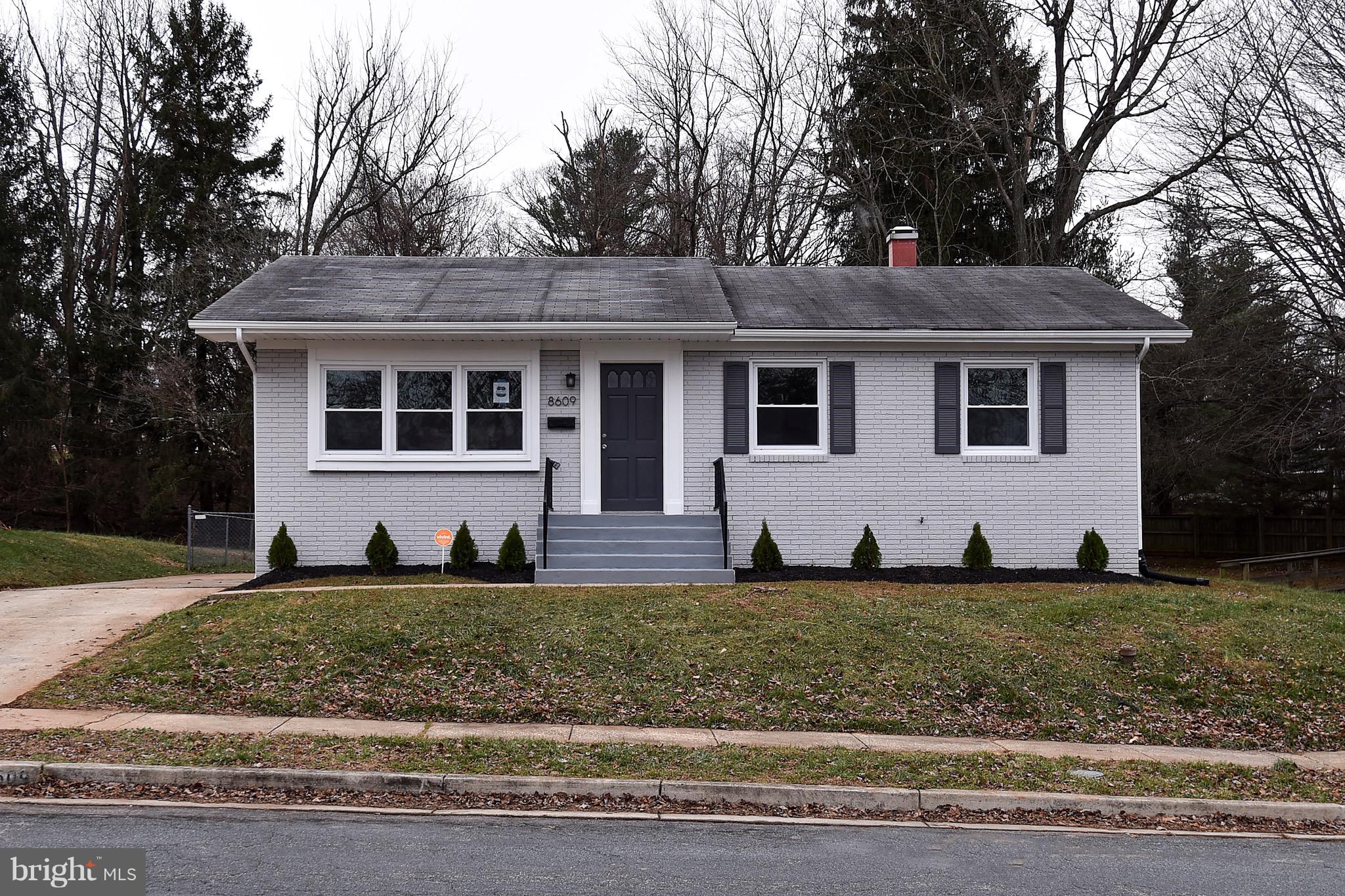 8609 Woodspring Road Randallstown, MD 21133 - Photo 2 of 43 a view of a yard in front of a house