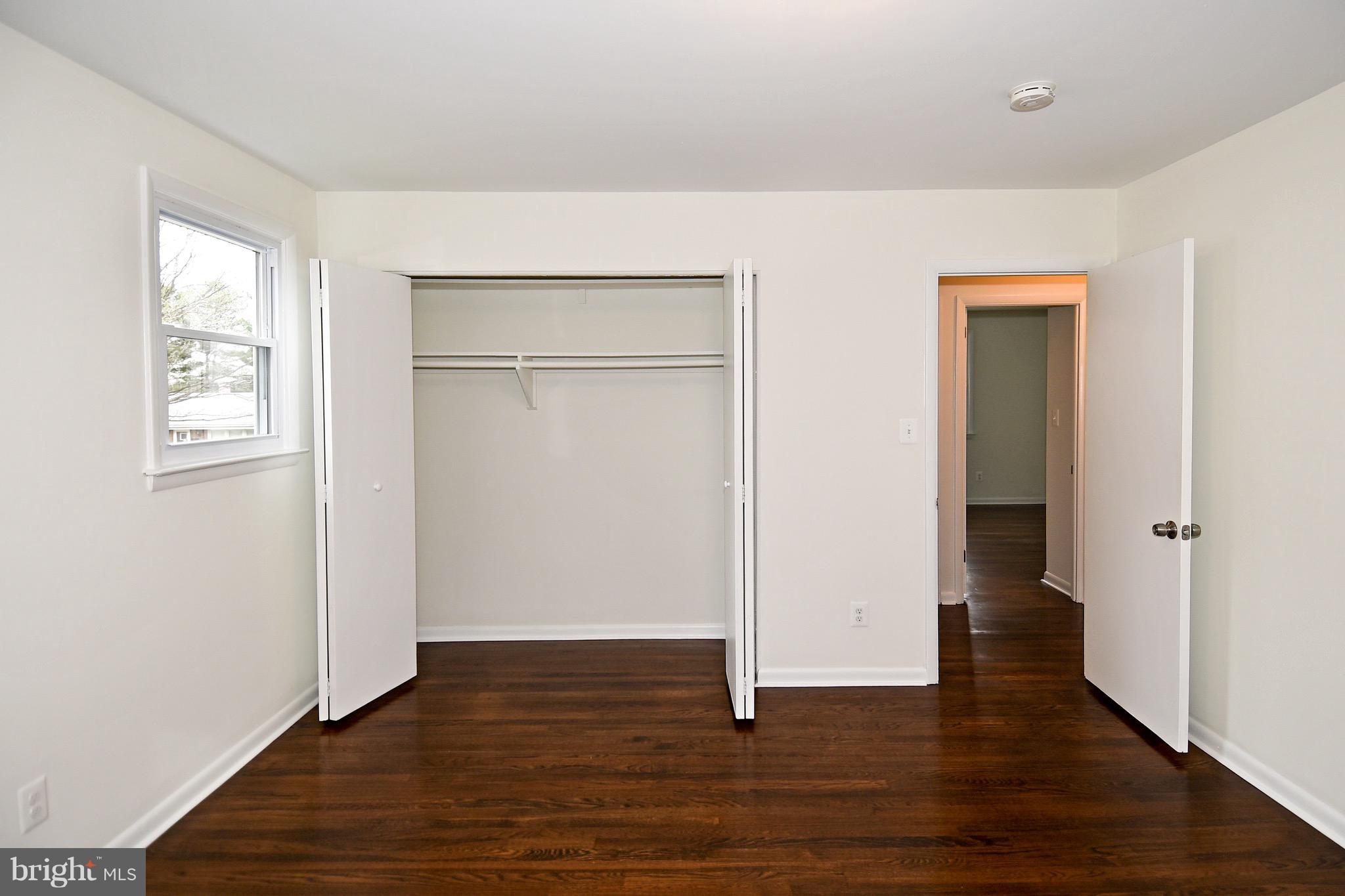 8609 Woodspring Road Randallstown, MD 21133 - Photo 17 of 43 a view of empty room with wooden floor