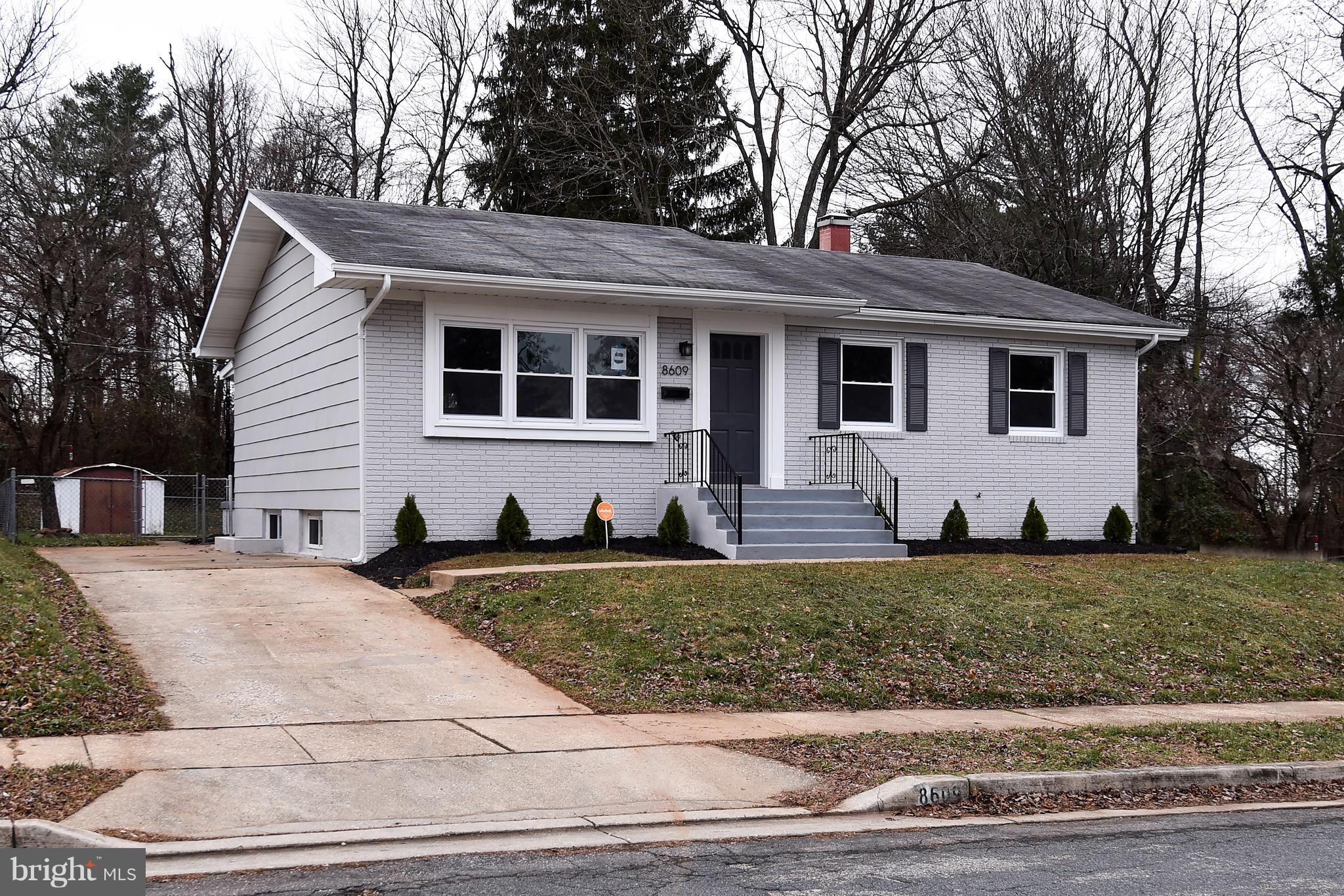 8609 Woodspring Road Randallstown, MD 21133 - Photo 3 of 43 a front view of a house with a yard