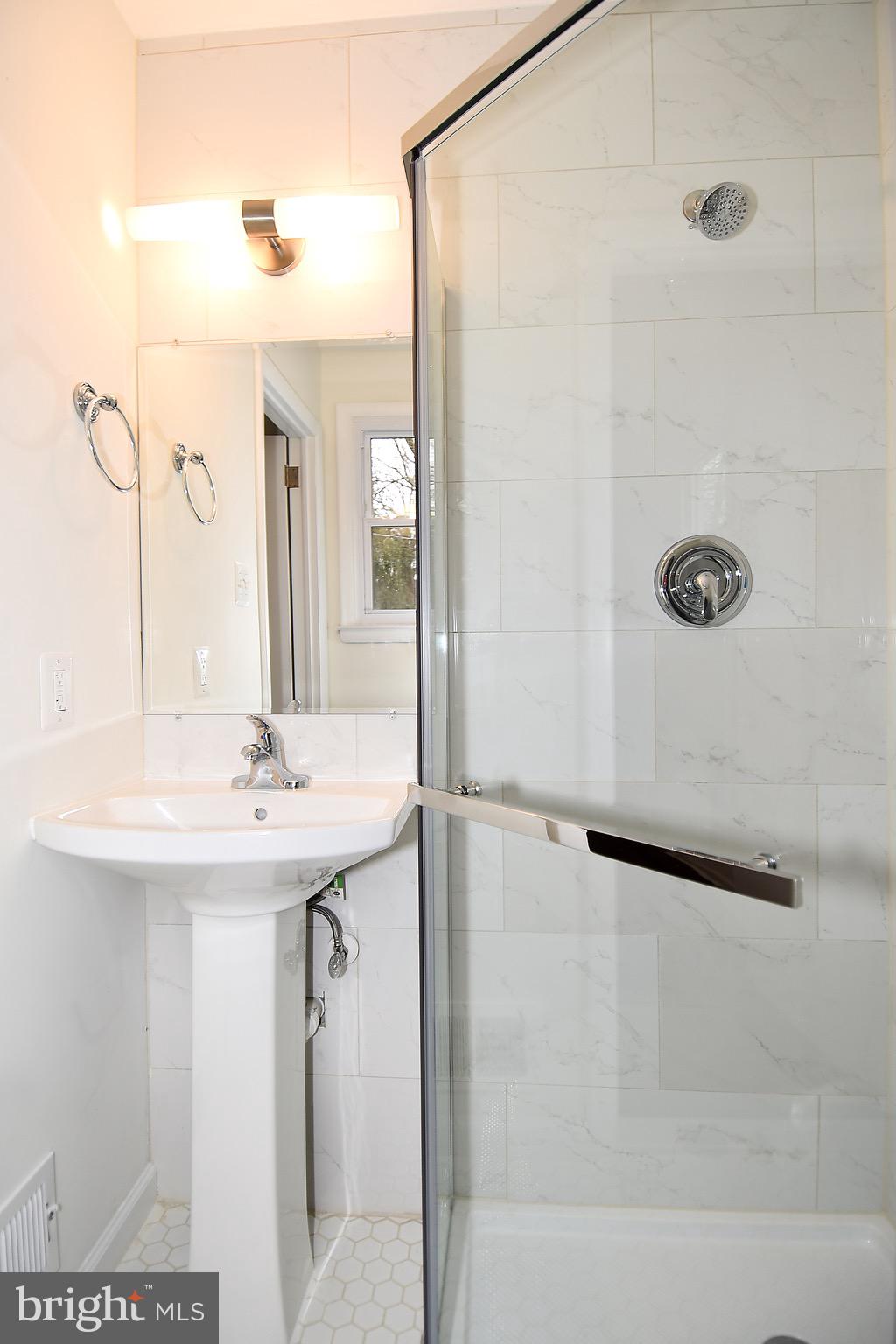 8609 Woodspring Road Randallstown, MD 21133 - Photo 21 of 43 a bathroom with a shower