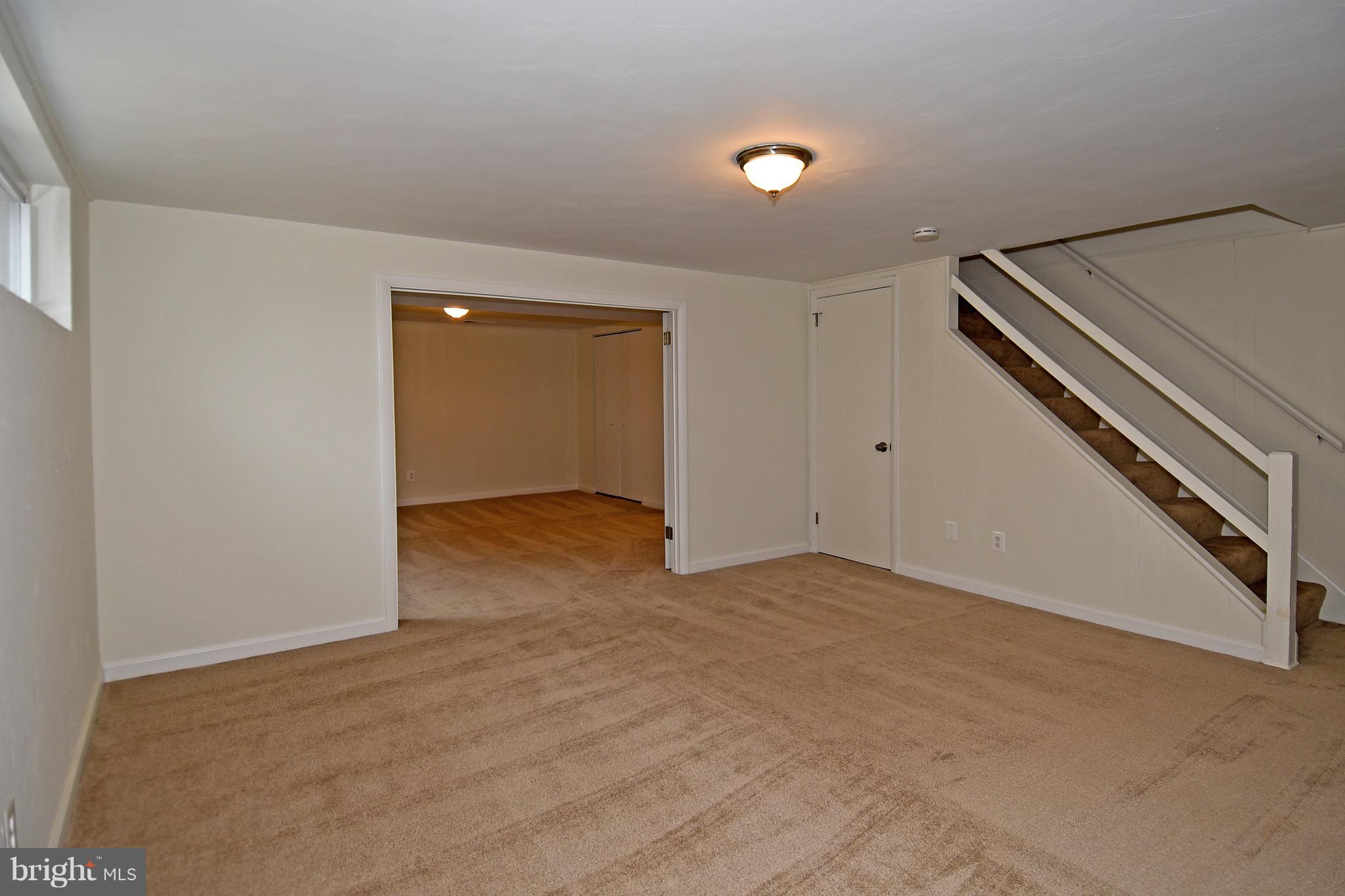 8609 Woodspring Road Randallstown, MD 21133 - Photo 30 of 43 an empty room with windows