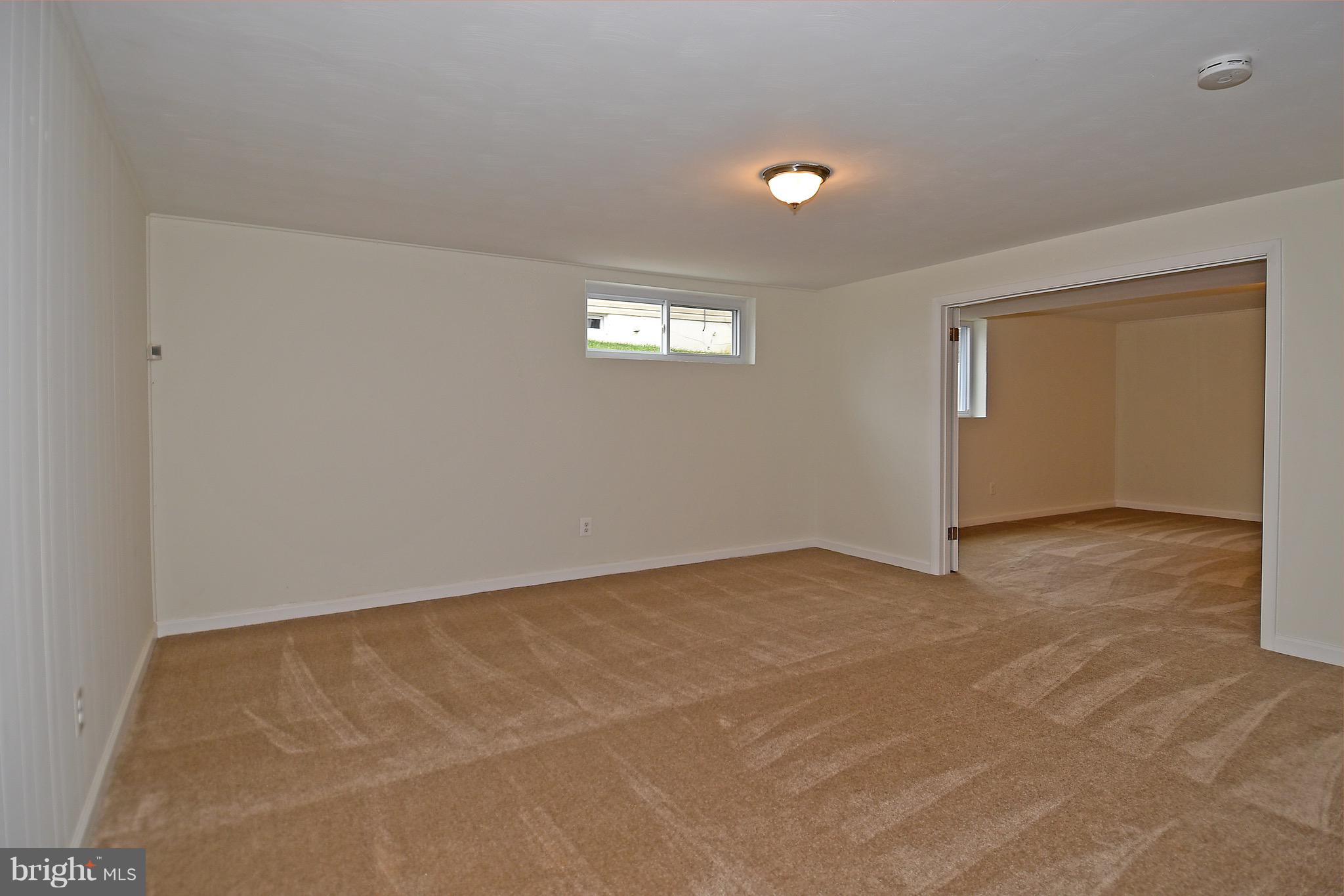 8609 Woodspring Road Randallstown, MD 21133 - Photo 31 of 43 a view of an empty room with a window