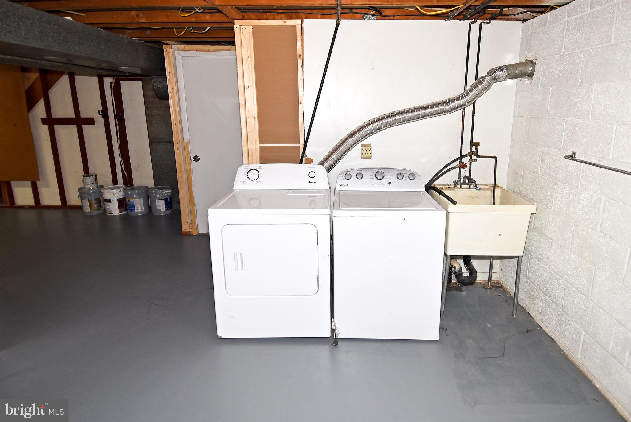 8609 Woodspring Road Randallstown, MD 21133 - Photo 38 of 43 a utility room with dryer and washer