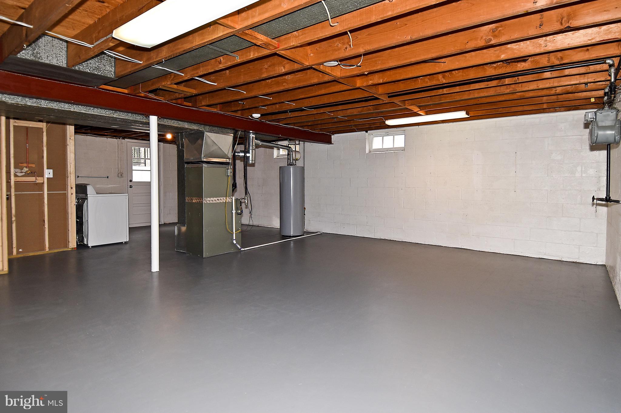 8609 Woodspring Road Randallstown, MD 21133 - Photo 39 of 43 a view of empty room with wooden floor