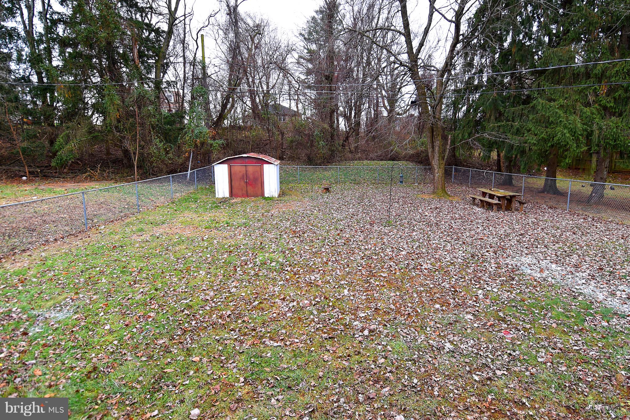 8609 Woodspring Road Randallstown, MD 21133 - Photo 42 of 43 a backyard of a house with a yard and outdoor seating