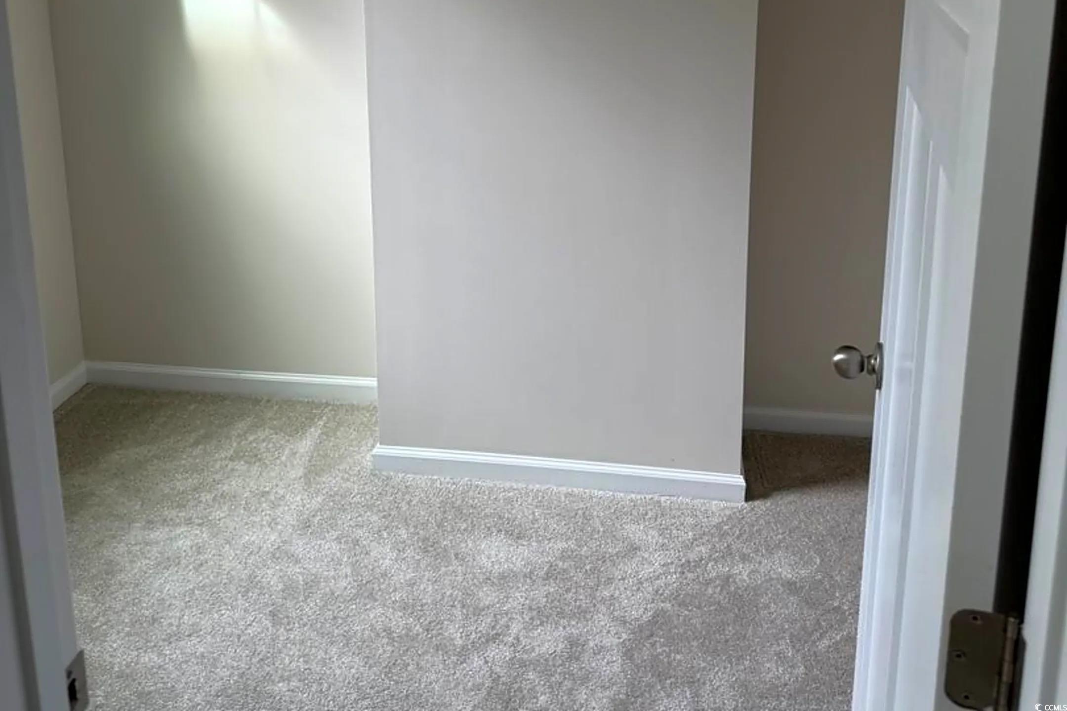 157 B Villa Grande Street, Unit B Myrtle Beach, SC 29579 - Photo 18 of 28 Unfurnished room featuring light carpet and baseboards