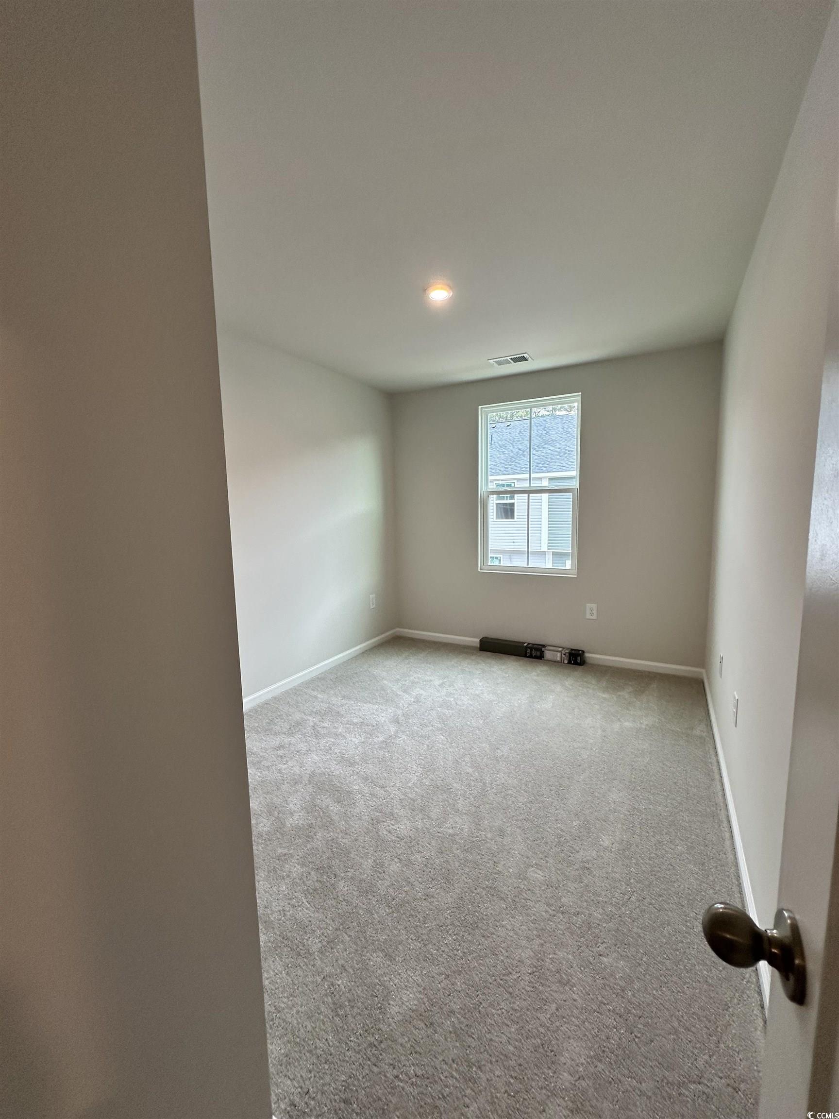 157 B Villa Grande Street, Unit B Myrtle Beach, SC 29579 - Photo 20 of 28 Carpeted empty room with baseboards