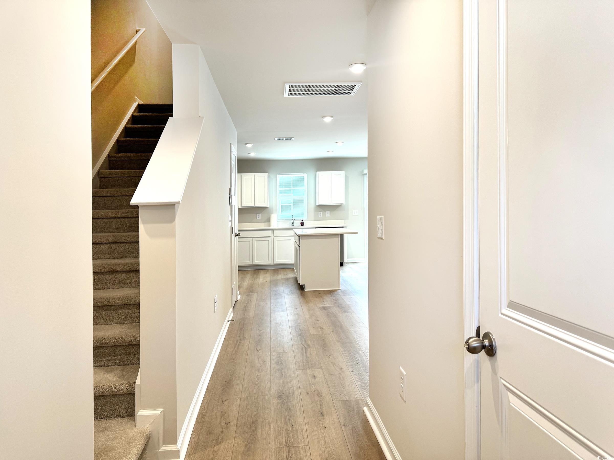 157 B Villa Grande Street, Unit B Myrtle Beach, SC 29579 - Photo 5 of 28 Corridor featuring light wood-style floors, stairway, and recessed lighting
