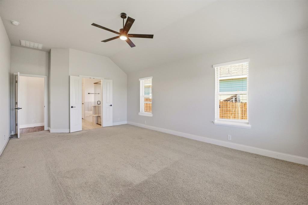 800 Jaguar Ridge Godley, TX 76044 - Photo 8 of 23 a view of a livingroom with a ceiling fan & window