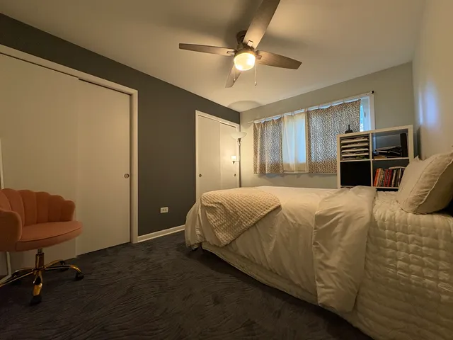 a bedroom with a bed and furniture