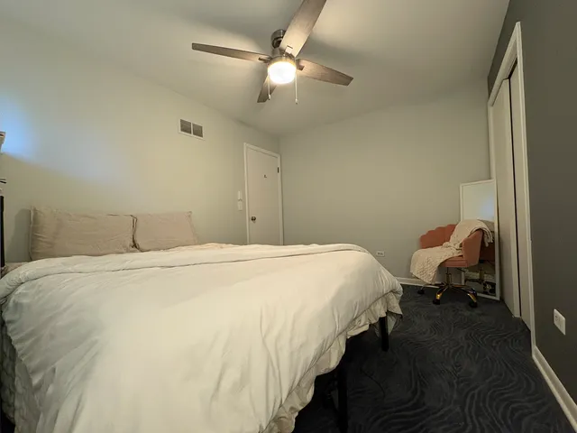 a bedroom with bed and window