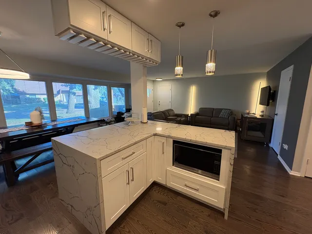 a kitchen with a sink and a stove top oven