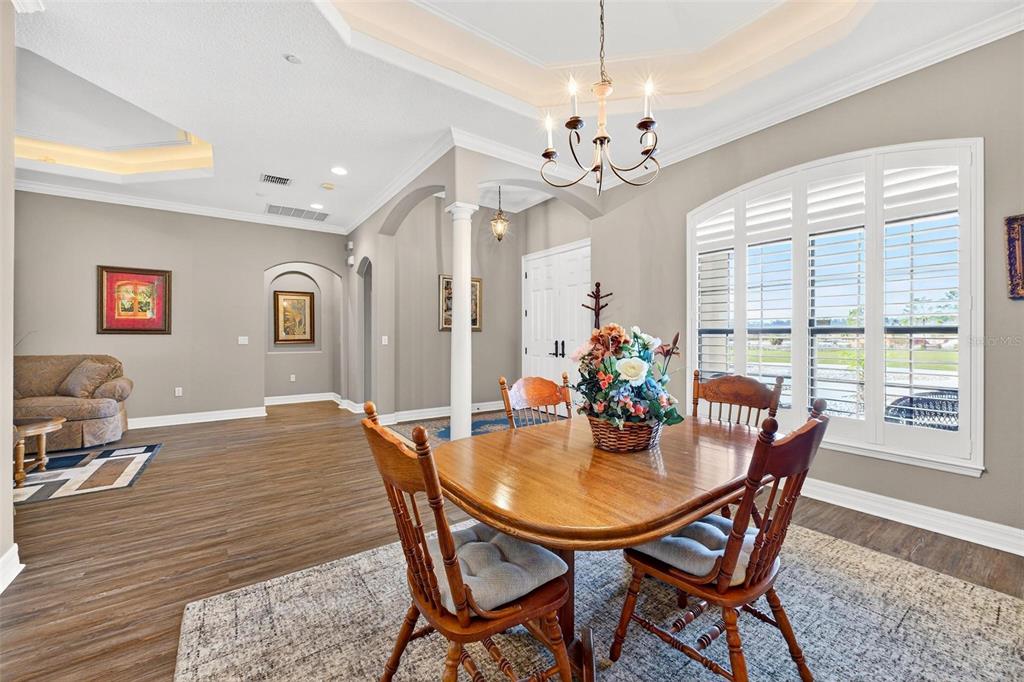 19850 Sugarloaf Mountain Road Clermont, FL 34715 - Photo 13 of 100 a view of a dining room with furniture window and wooden floor