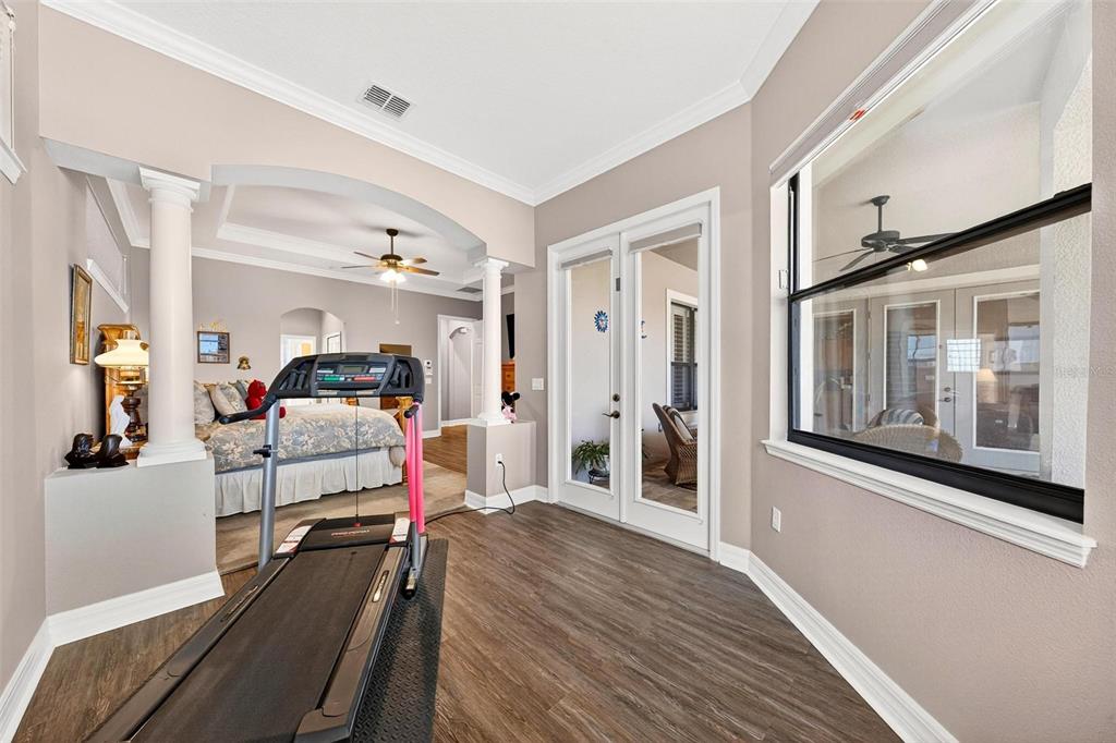 19850 Sugarloaf Mountain Road Clermont, FL 34715 - Photo 18 of 100 a bedroom with furniture and natural light