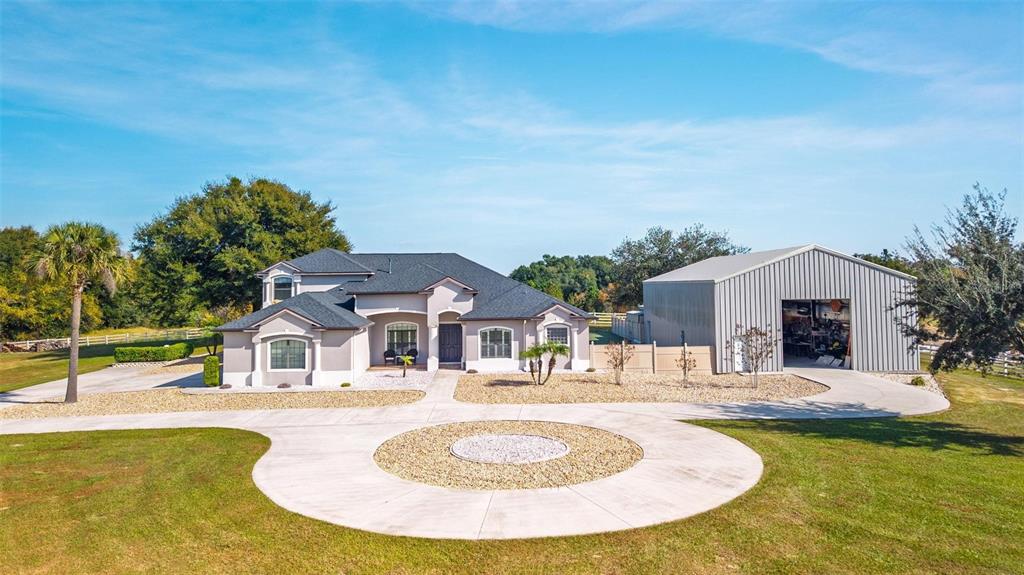 19850 Sugarloaf Mountain Road Clermont, FL 34715 - Photo 2 of 100 a swimming pool with outdoor seating