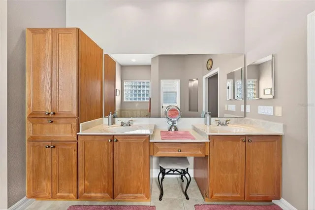 a kitchen with granite countertop a sink stove and cabinets