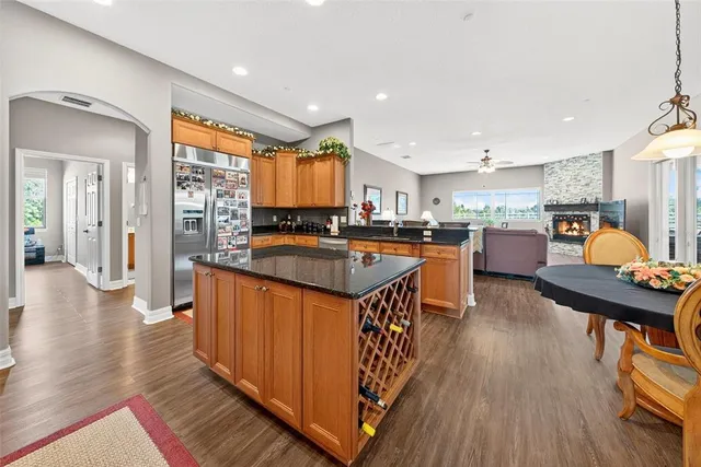 a view of a hallway with wooden floor and entryway
