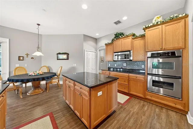 a bathroom with a sink toilet a mirror and shower