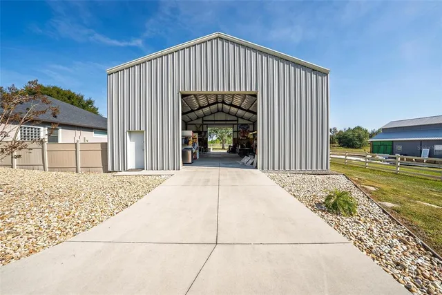 a view of a swimming pool with an outdoor space and seating area