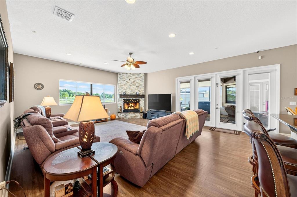 19850 Sugarloaf Mountain Road Clermont, FL 34715 - Photo 43 of 100 a living room with furniture and a wooden floor