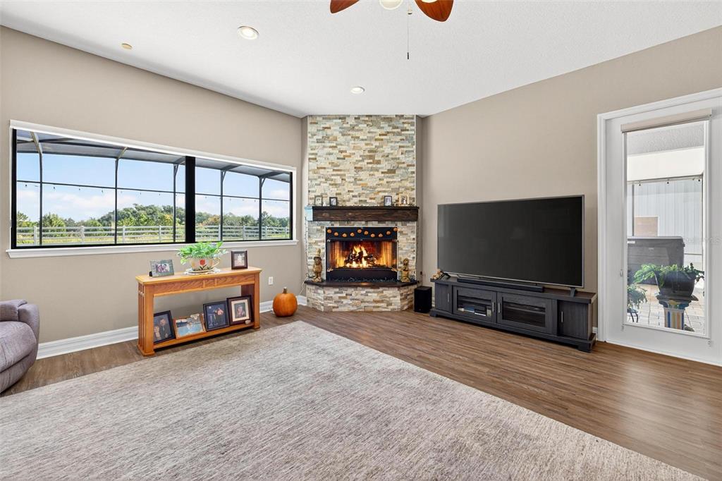 19850 Sugarloaf Mountain Road Clermont, FL 34715 - Photo 45 of 100 a living room with furniture and a flat screen tv