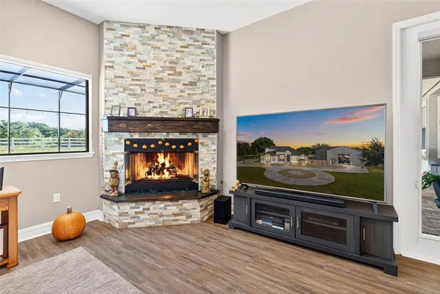 a view of swimming pool in the backyard of house with outdoor seating
