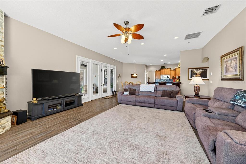 19850 Sugarloaf Mountain Road Clermont, FL 34715 - Photo 49 of 100 a living room with furniture and a flat screen tv