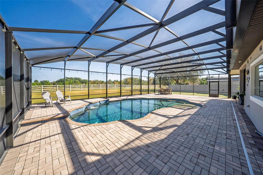 19850 Sugarloaf Mountain Road Clermont, FL 34715 - Photo 6 of 100 a view of a swimming pool with a patio