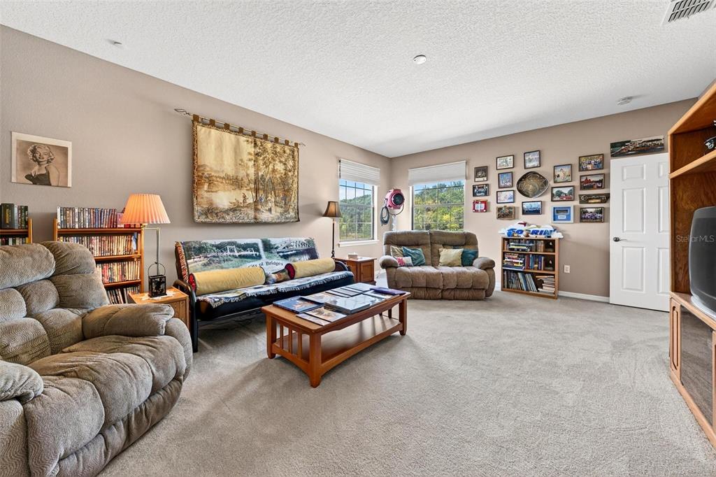 19850 Sugarloaf Mountain Road Clermont, FL 34715 - Photo 68 of 100 a living room with furniture and a large window